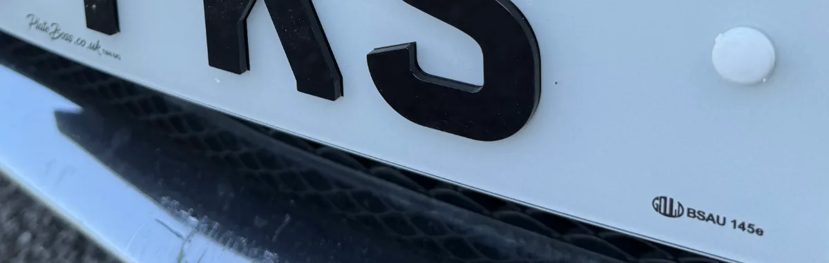 What Documents Do You Need to Get Number Plates Made? 2 Close-up of the BS AU 145e marking and PlateBoss supplier details on a road-legal number plate