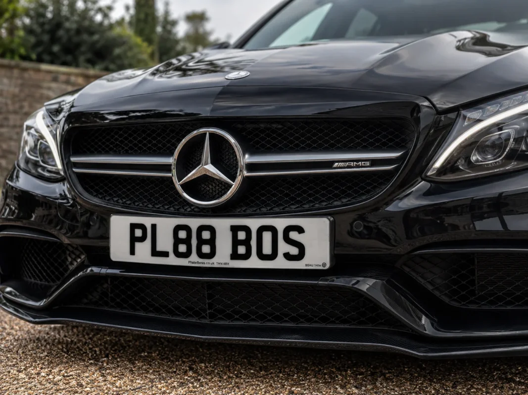 Pre-Drilled Number Plates: Why We Don't Sell Them (and How to Drill Yours) 2 Why pre drilled number plates rarely fit: front plate fitted to a Mercedes-AMG, demo registration PL88 BOS