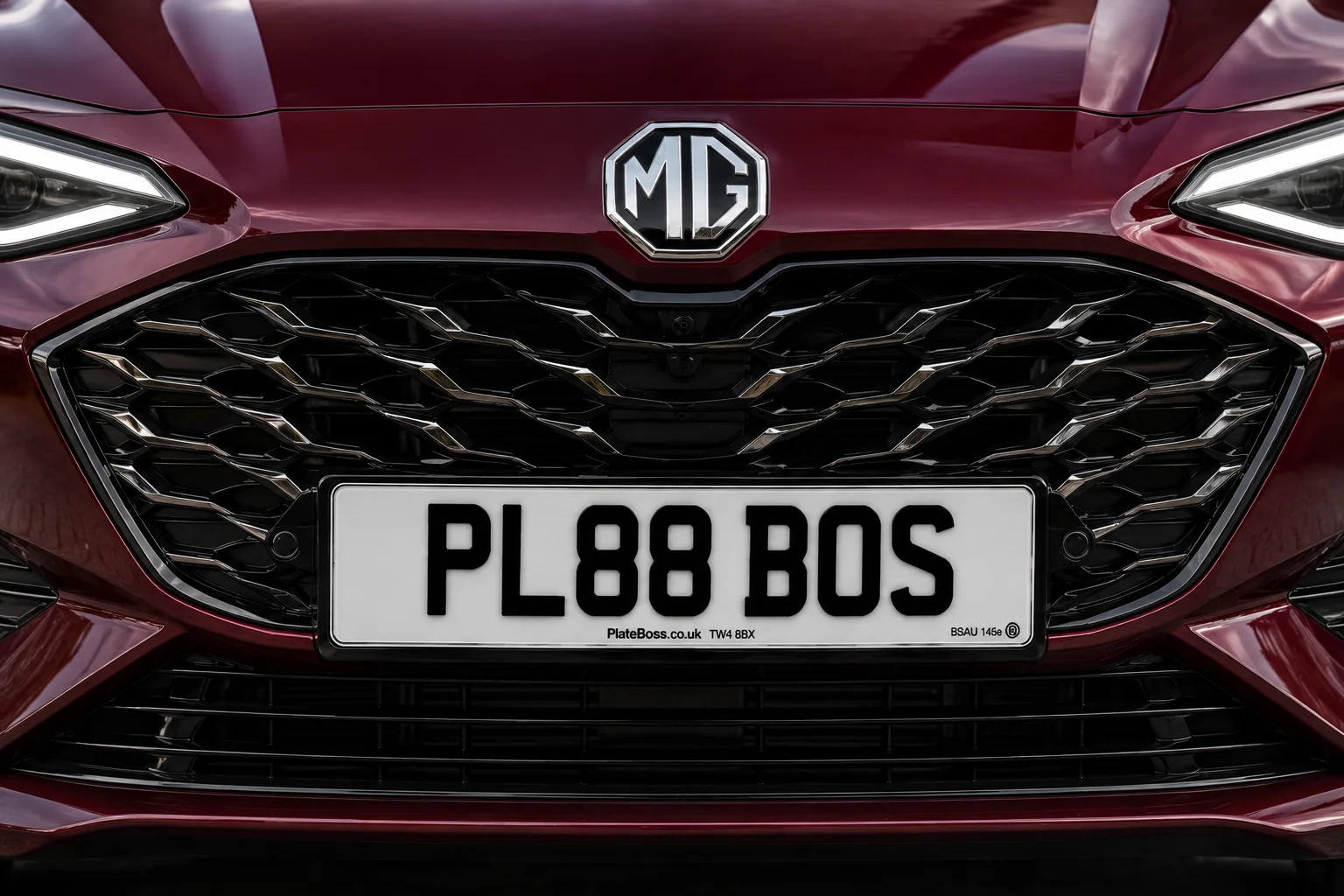 Correctly spaced road-legal front number plate on a red MG grille, demo registration PL88 BOS